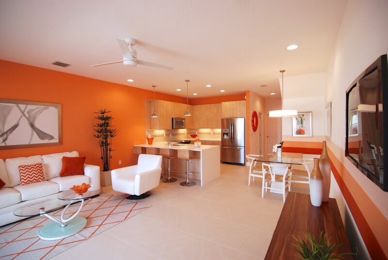 Sala com cozinha integrada na Orange CrushFoto: Divulgação