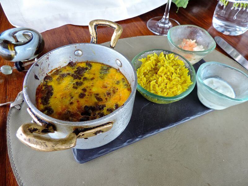 Babotie africano, que parece um escondidinho de carne moída com ovo e arroz bismati Foto: magari blu